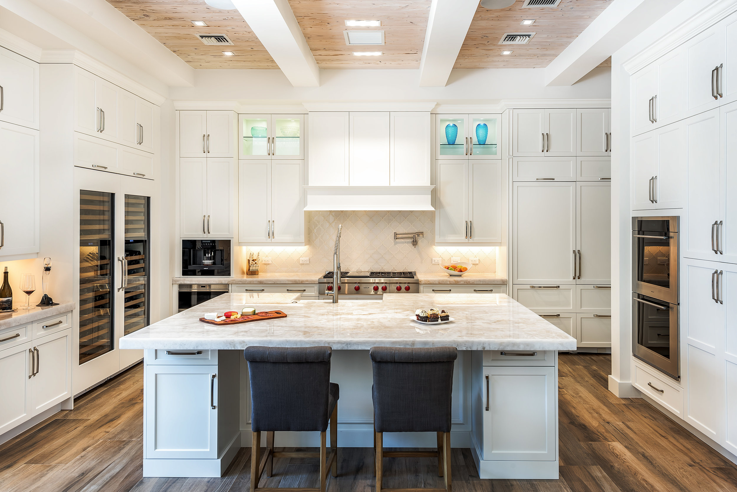White kitchen with marble island