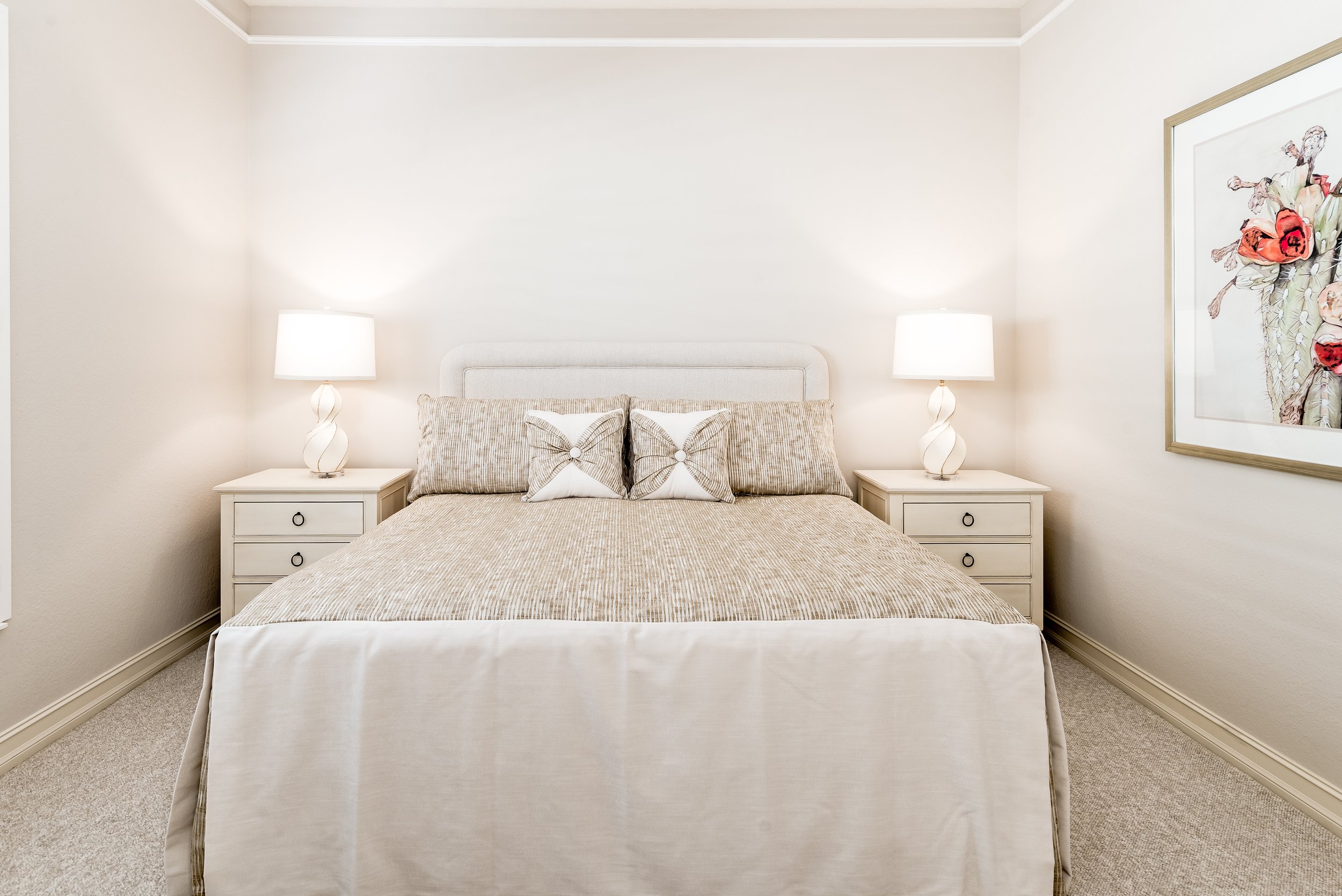Neutral guest bedroom with upholstered headboard